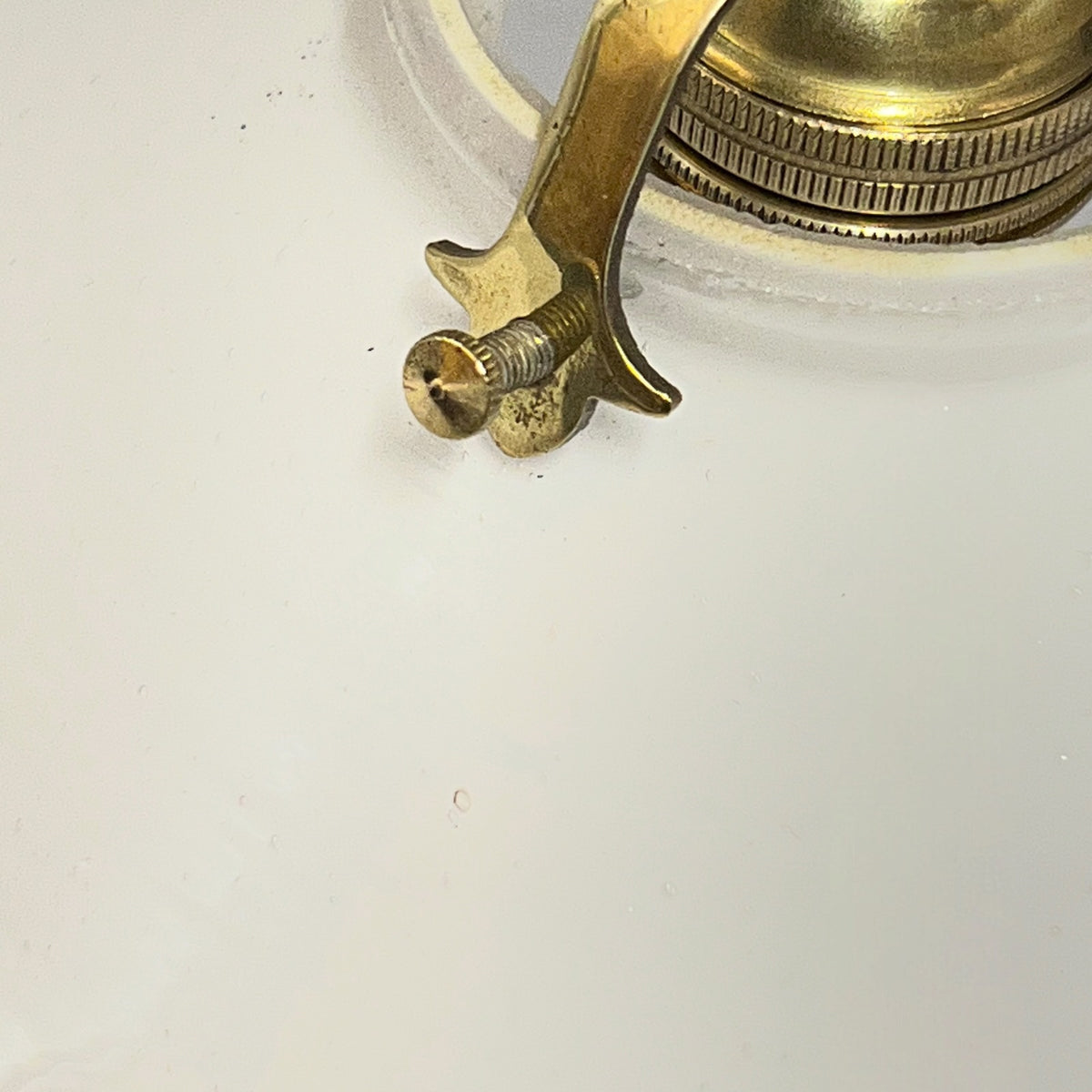 A close-up of a brass vintage light fitting 