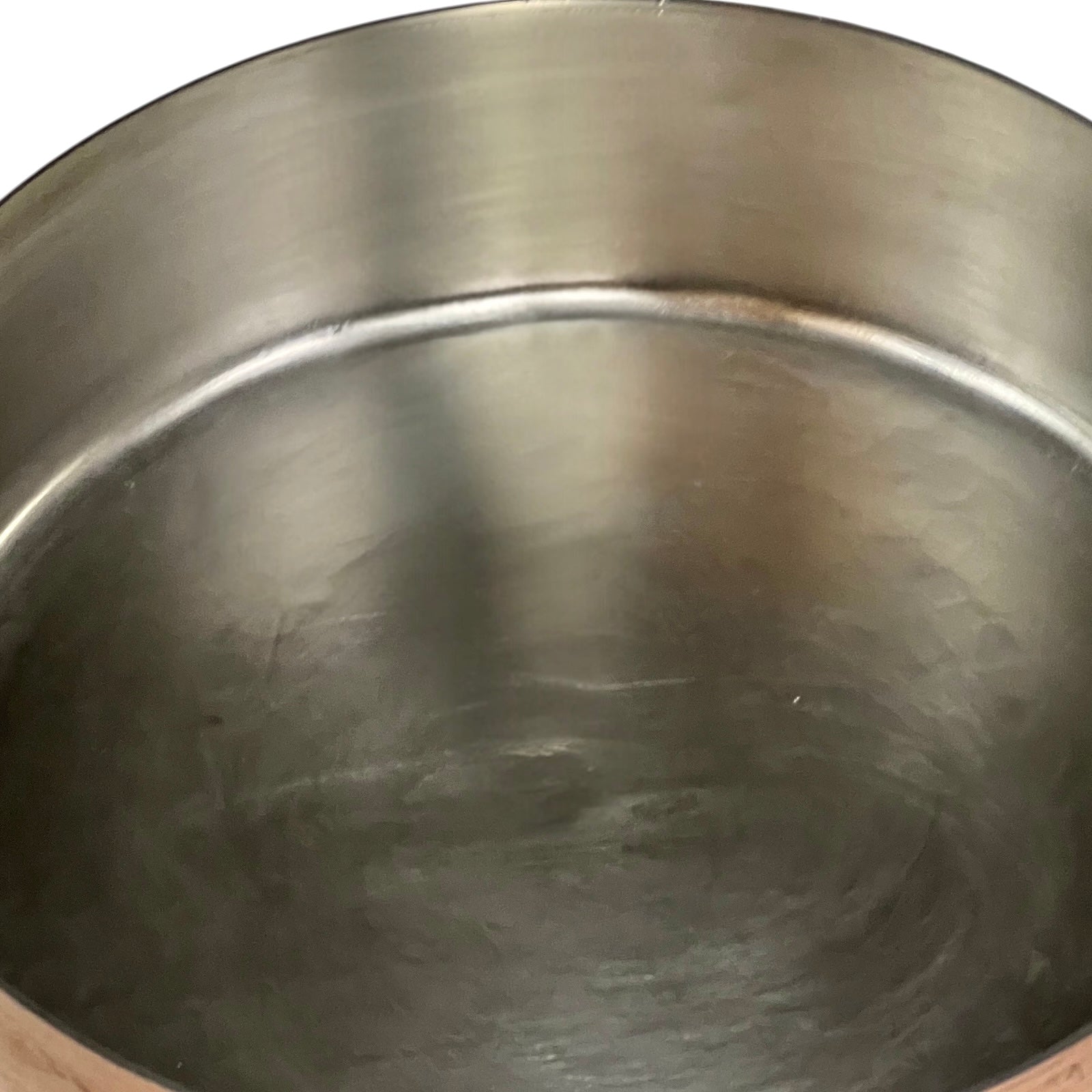 Close-up of a metallic pot with a reflective surface