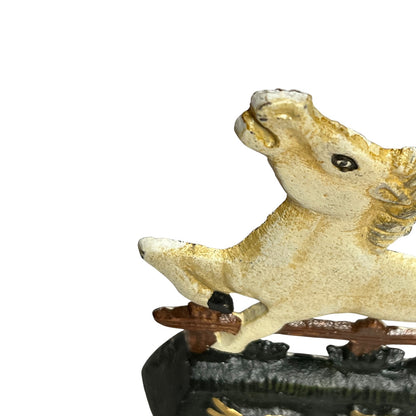 Close-up of a decorative horse figurine with a textured cream and gold finish, shown against a plain white background.