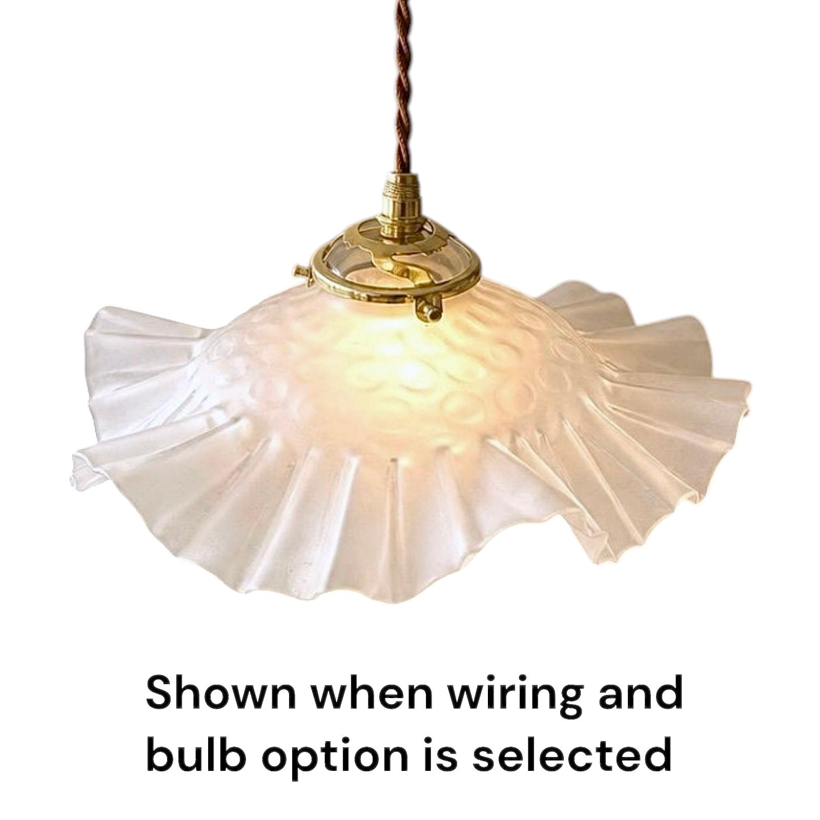 A vintage-style pendant light with a textured, ruffled off-white glass shade and a brass fixture, suspended by a brown cord. Text at the bottom reads 'Shown when wiring and bulb option is selected'.