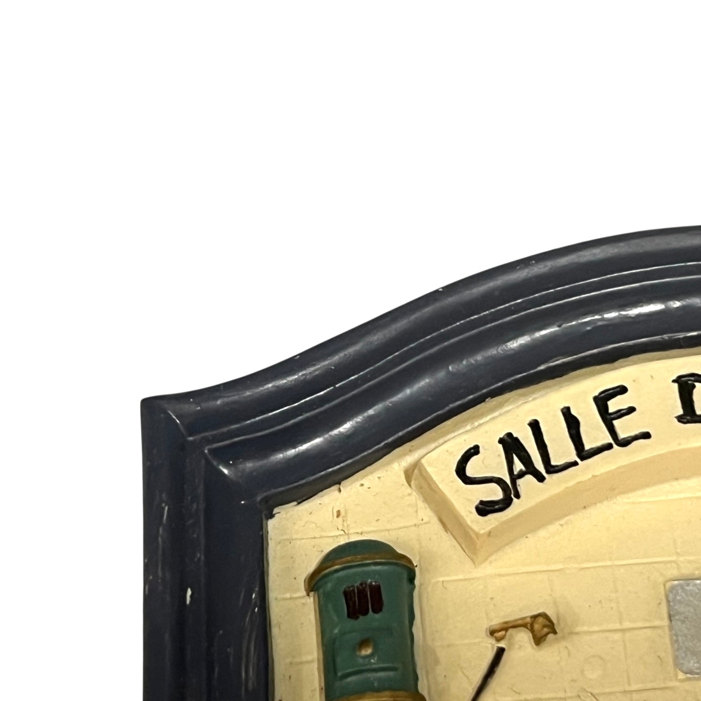 Decorative sign with 'SALLE' text on a white background