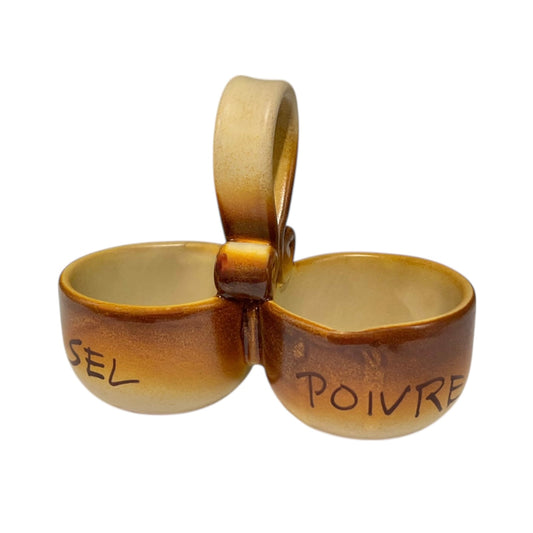 Ceramic salt and pepper shaker set with 'SEL' and 'POIVRE' writing on a white background