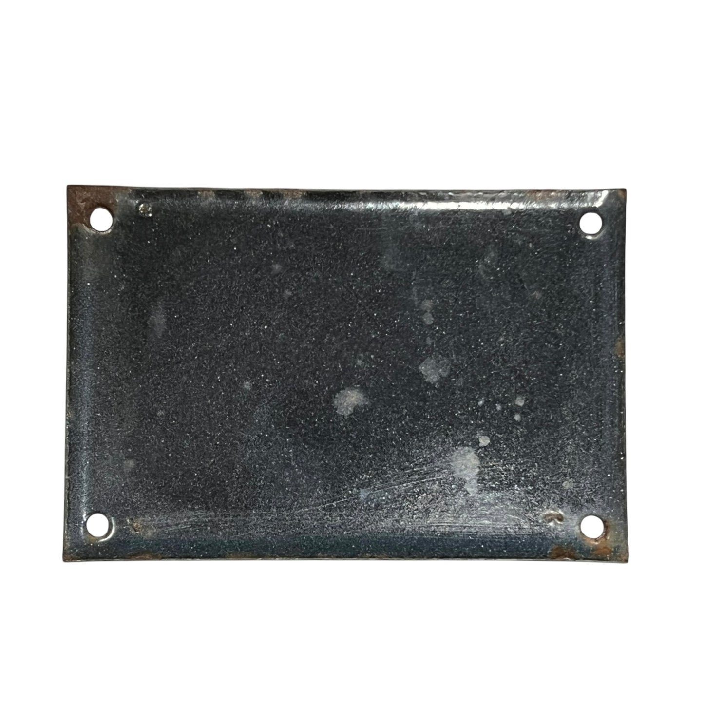 Rectangular metal plate with four holes on a white background