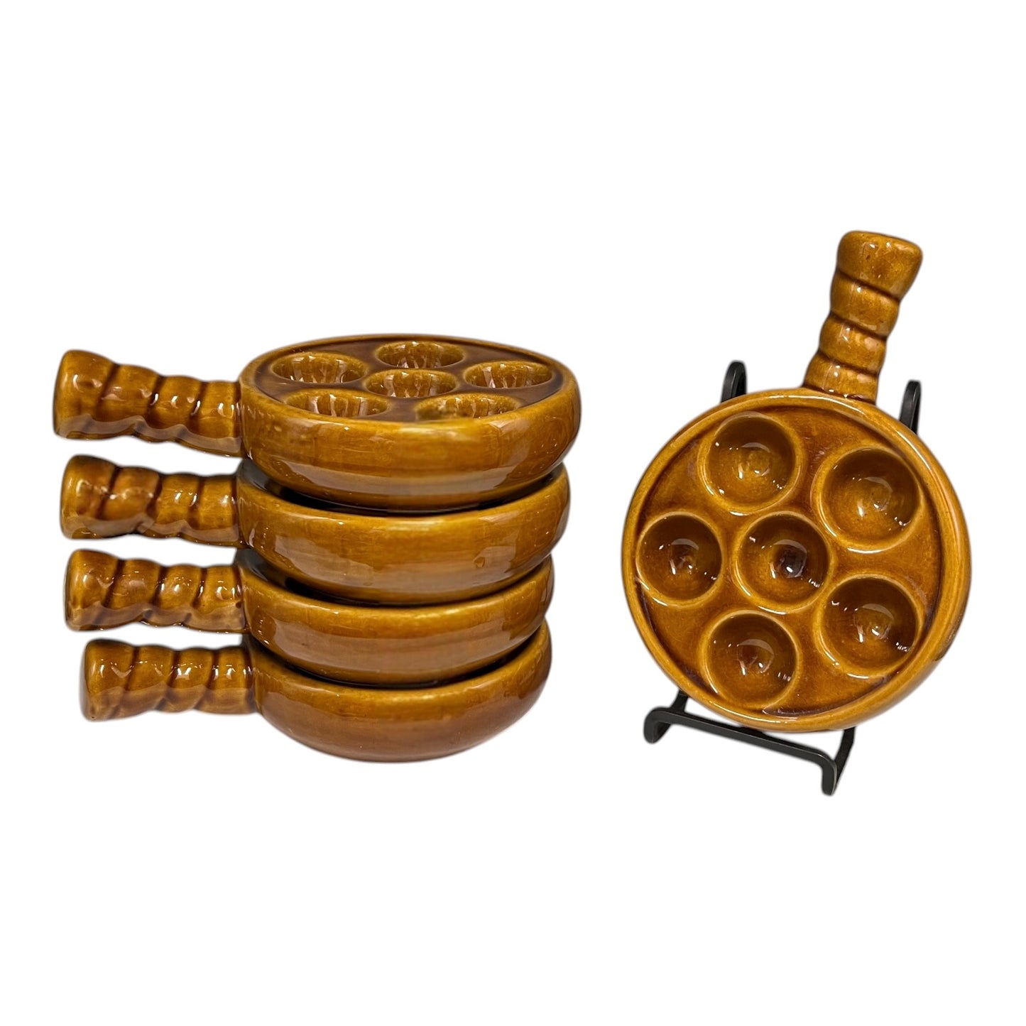 set of 5 amber brown coloured 6 hole snail plates on a white background 