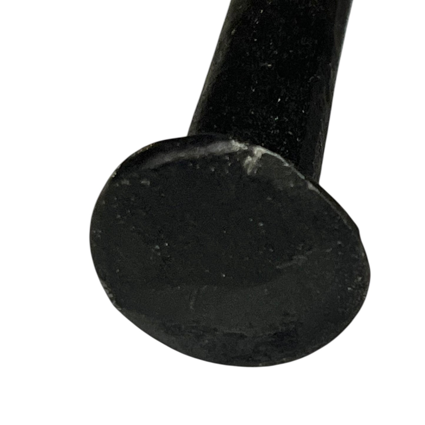 Close up of cow toilet paper holder with black and white pattern on a white background