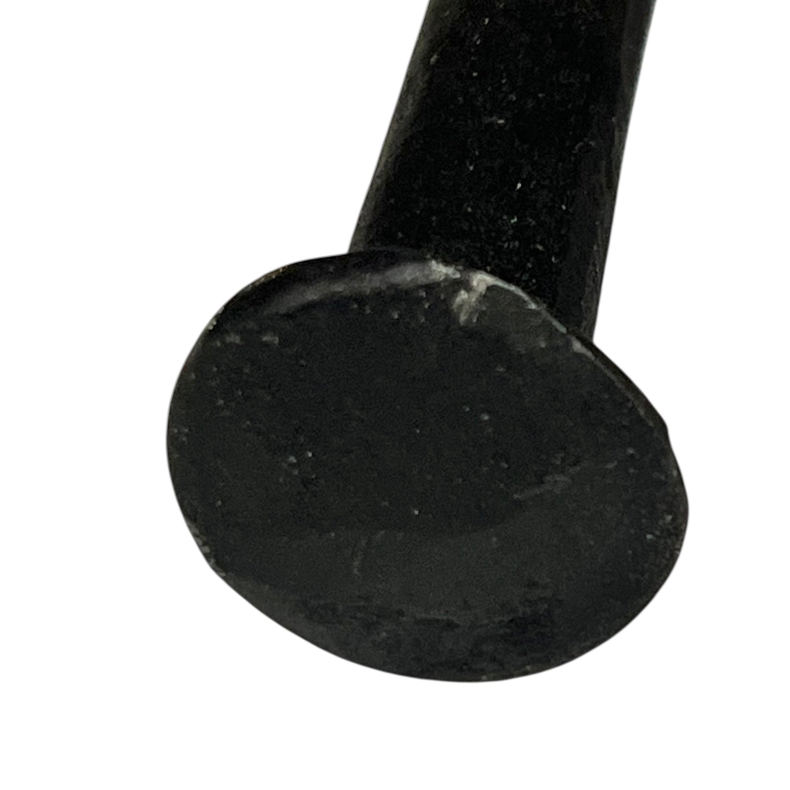 Close up of cow toilet paper holder with black and white pattern on a white background