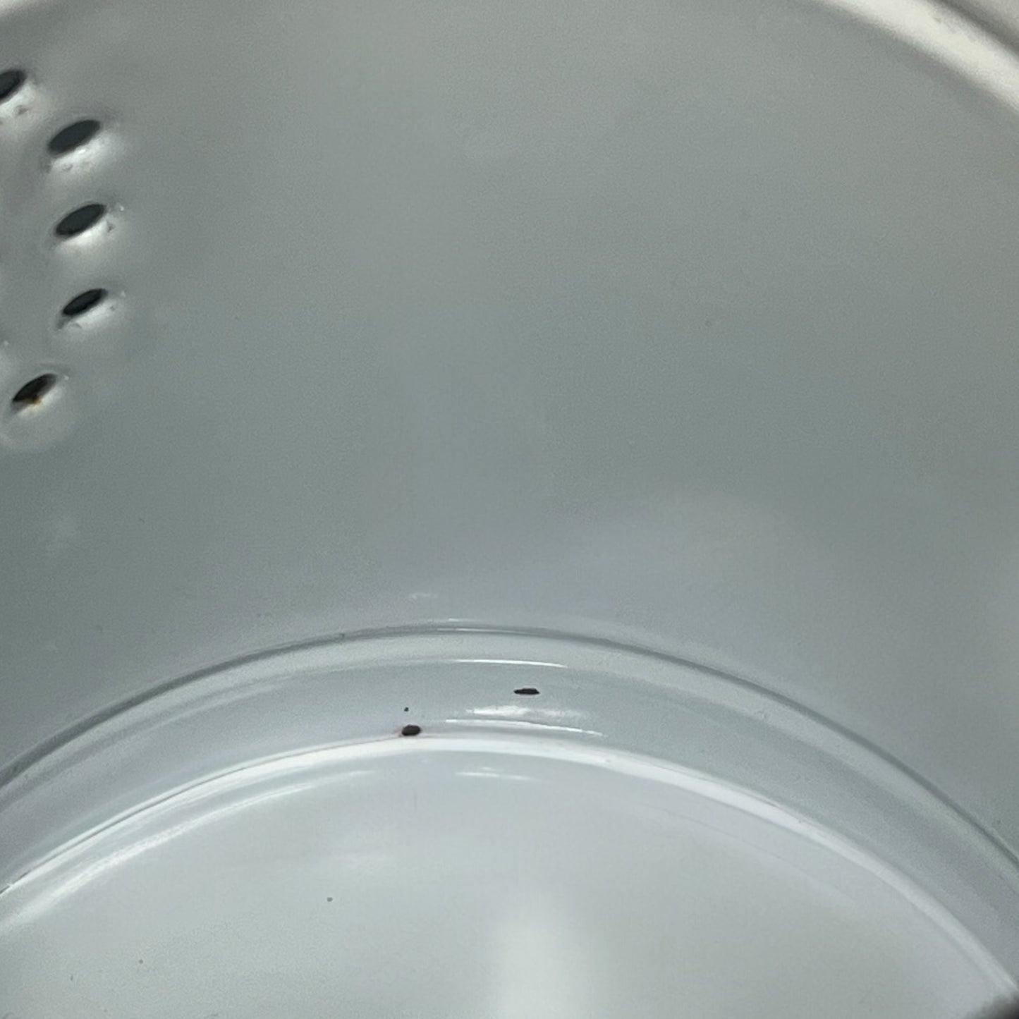 Close-up of a red teapot on a white background