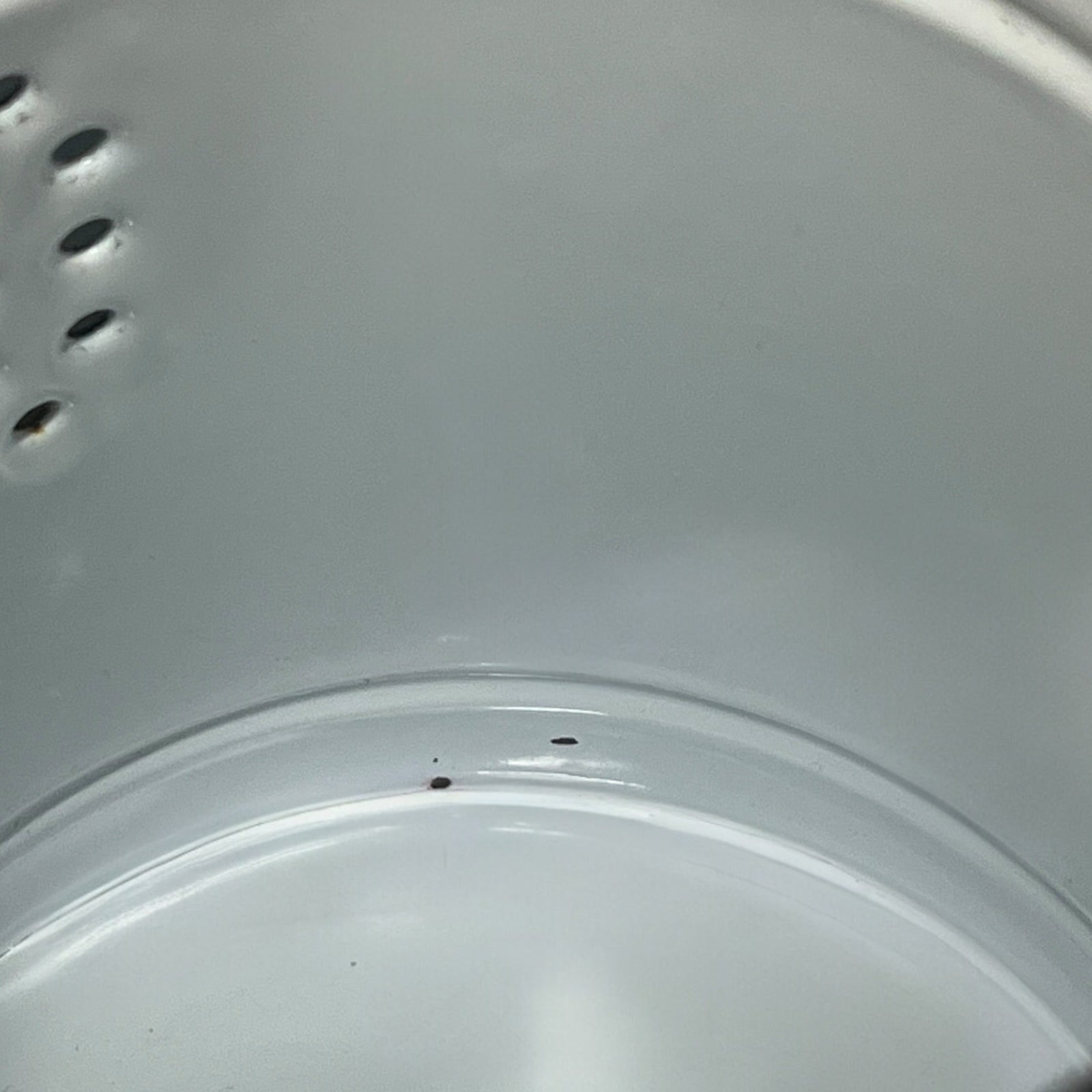 Close-up of a red teapot on a white background