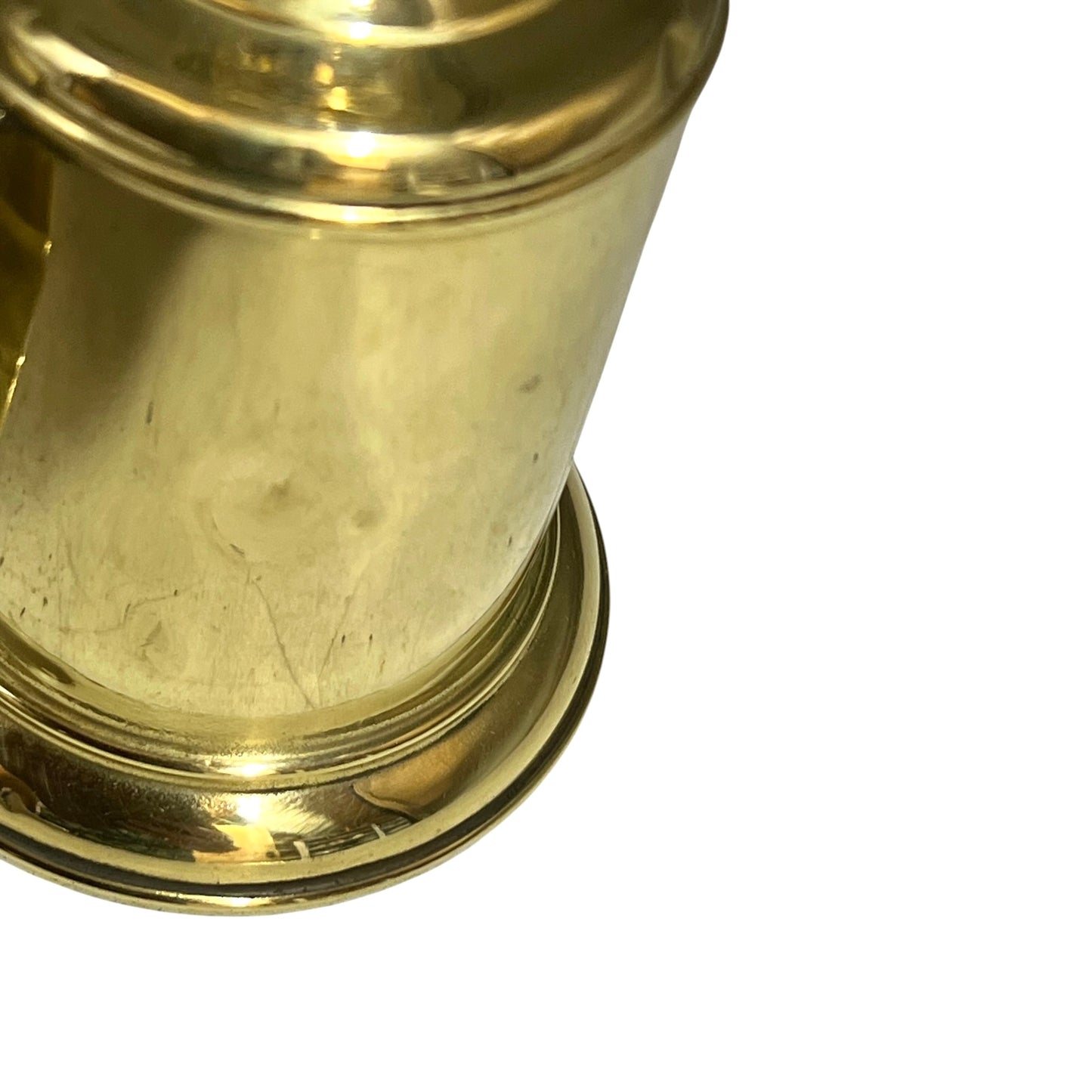 Close-up of a brass lamp on a white background