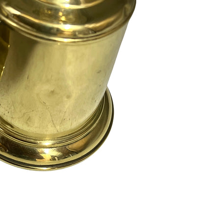 Close-up of a brass lamp on a white background