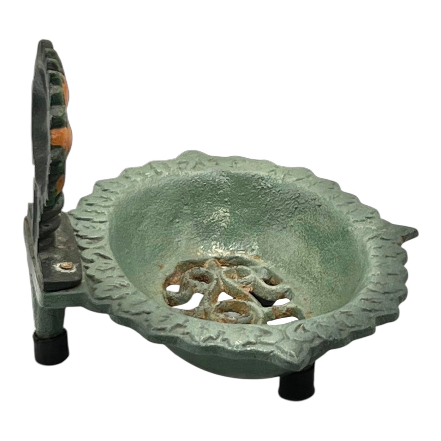 Decorative metal soap dish design on a white background