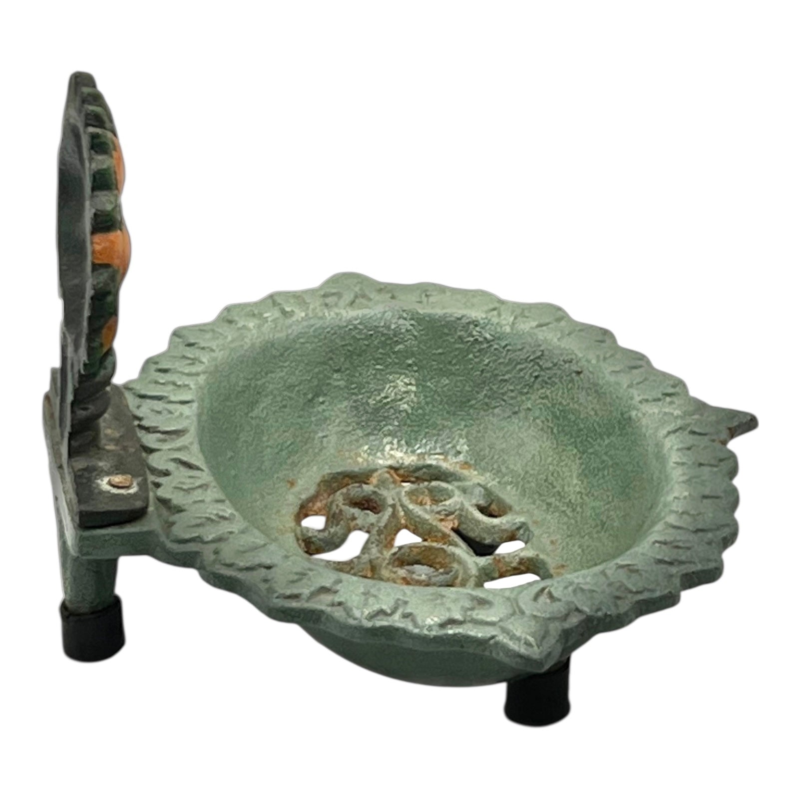 Decorative metal soap dish design on a white background