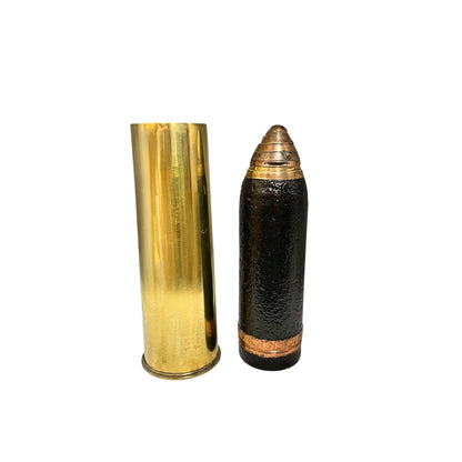 British WW1 18 pounder militaria relic trench art, a brass shell, a black shrapnel case and a brass fuse, upright, for display or militaria gift, set on a white background 