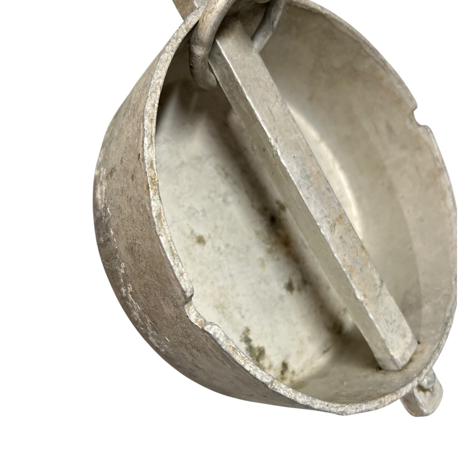 Close up of a vintage metal milk churn on a white background