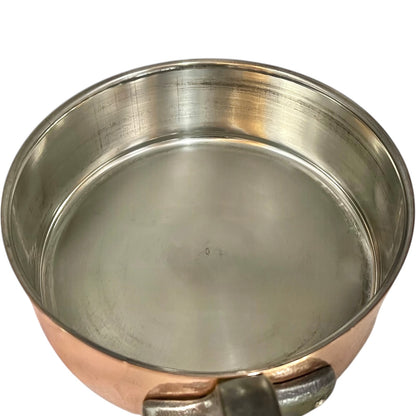 inside of copper pan with tin lining on a white background