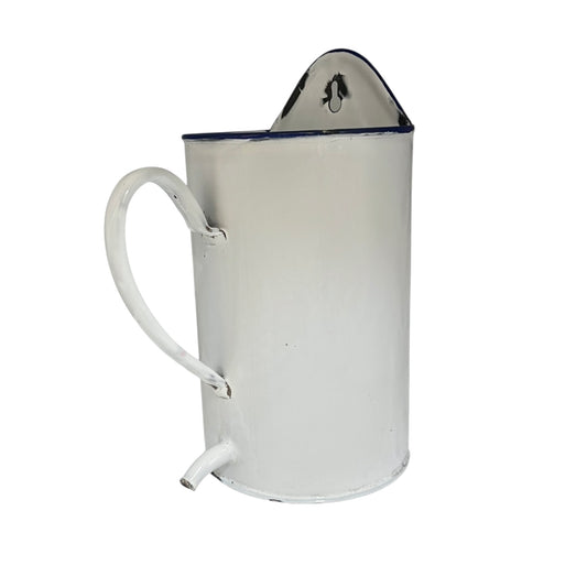 White enamel pitcher with a blue rim on a white background