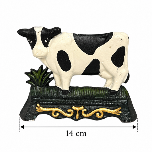 Cow shaped doorstop with a 14cm measurement underneath 