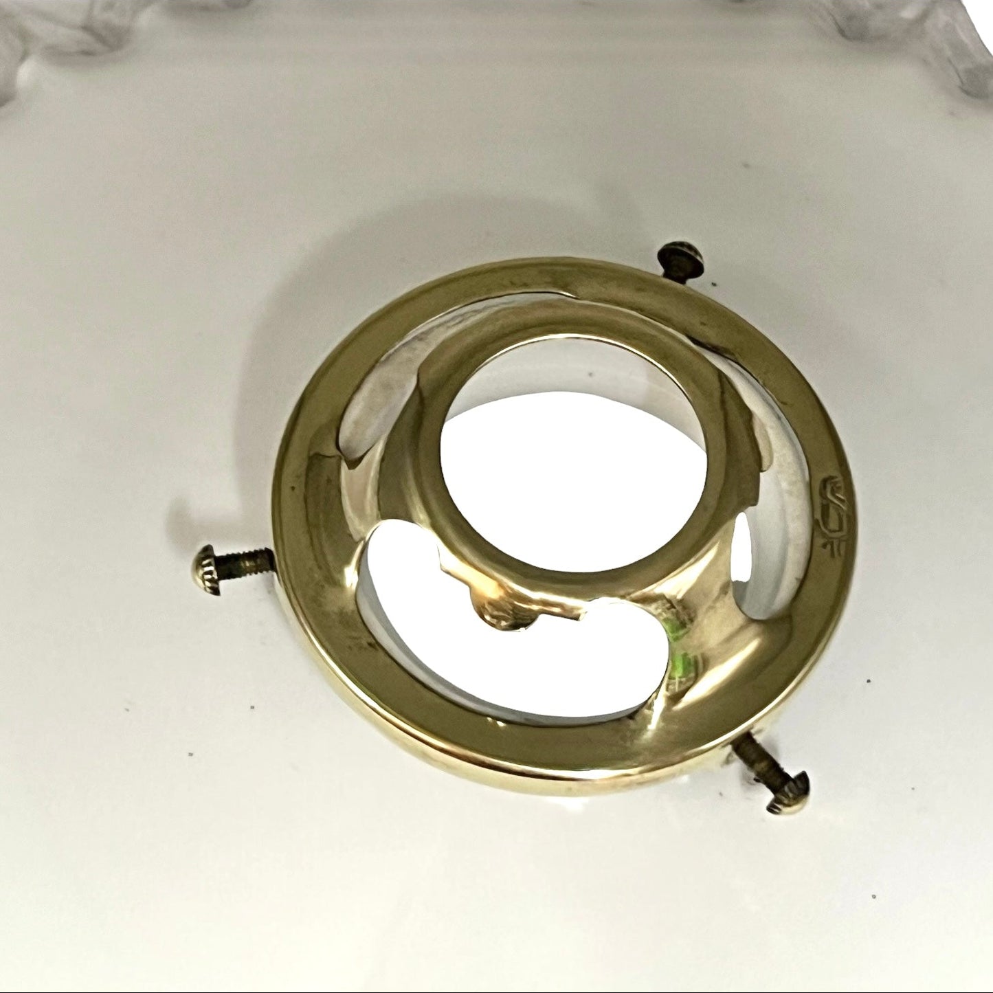 close up of a vintage brass lightshade gallery