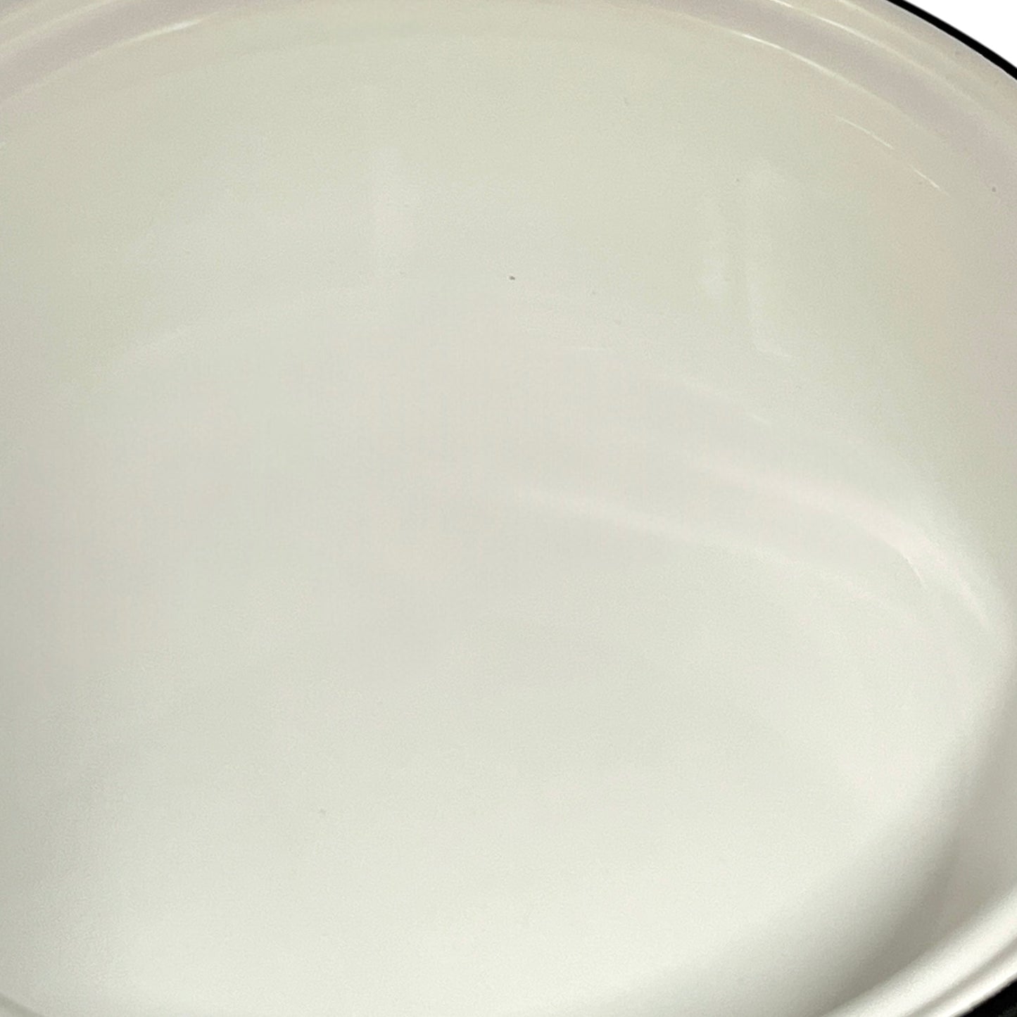 close up of White enamel saucepan inside on a white background