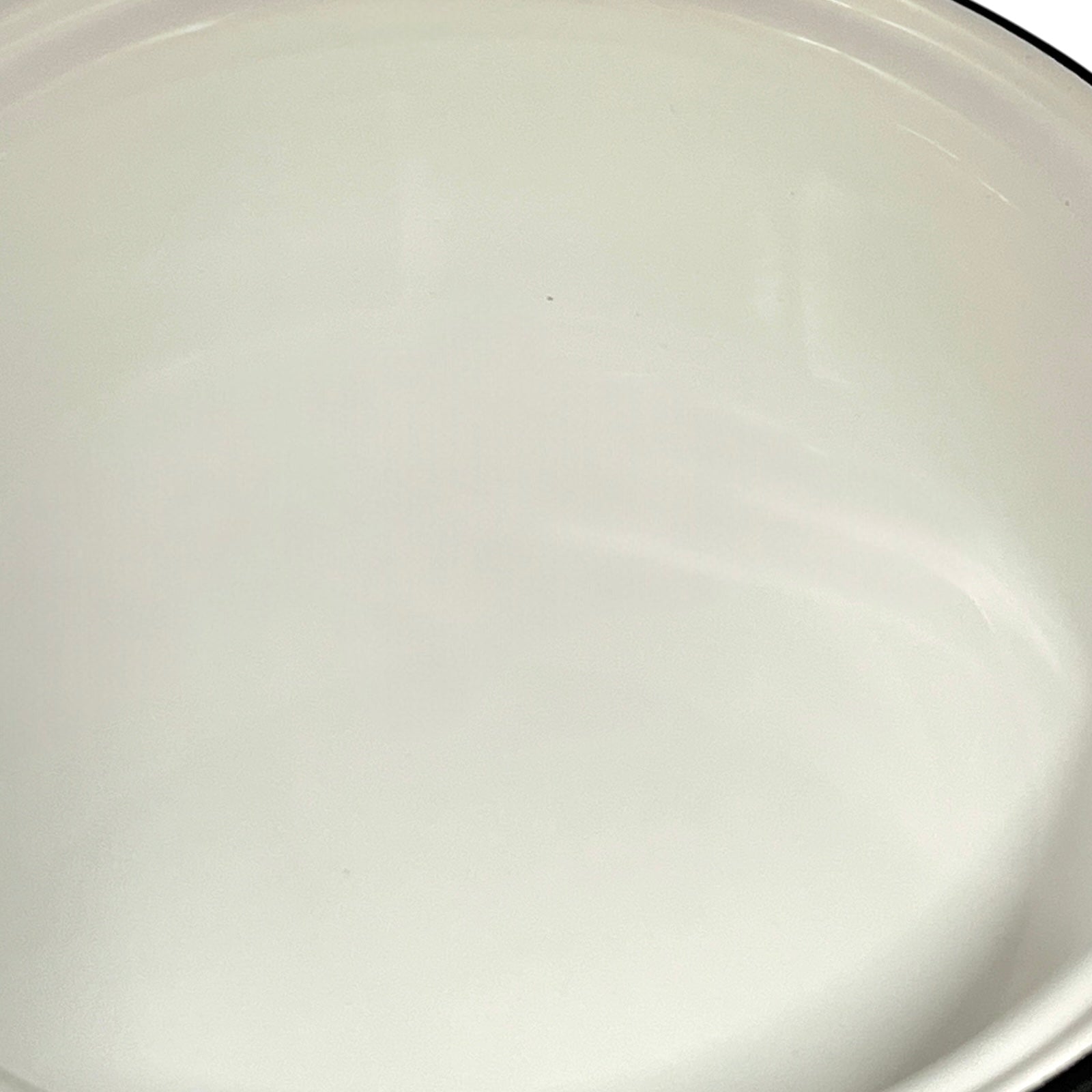 close up of White enamel saucepan inside on a white background