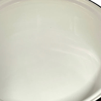 close up of White enamel saucepan inside on a white background