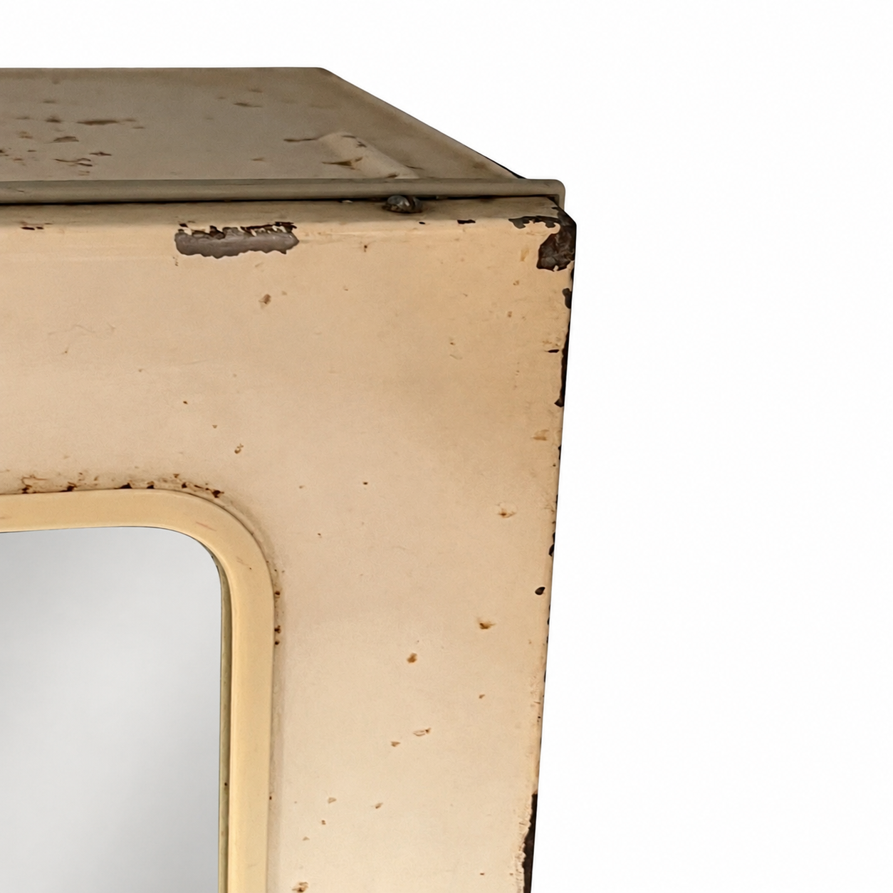 close up of a vintage metal bathroom cabinet