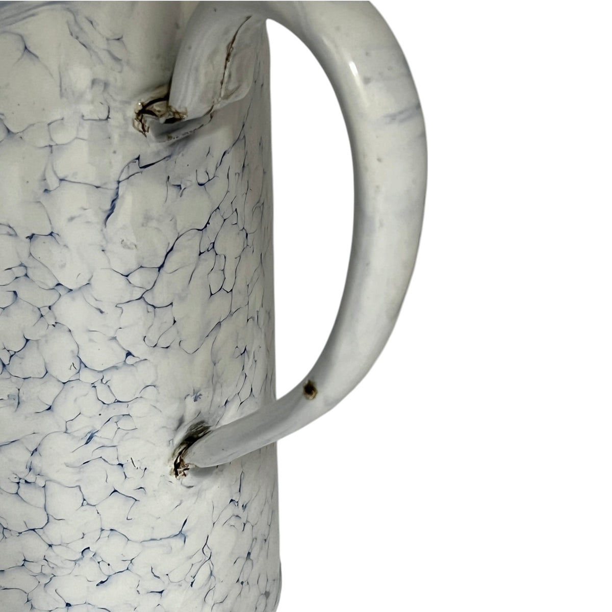 Close up of a vintage-style white enamel planter with a blue crackle pattern, a metal top loop, a side handle, and a small spout, shown on a plain white background.