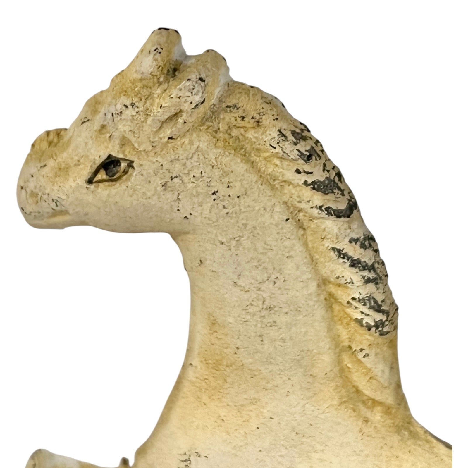 Close up of white horse toilet paper holder against a white background