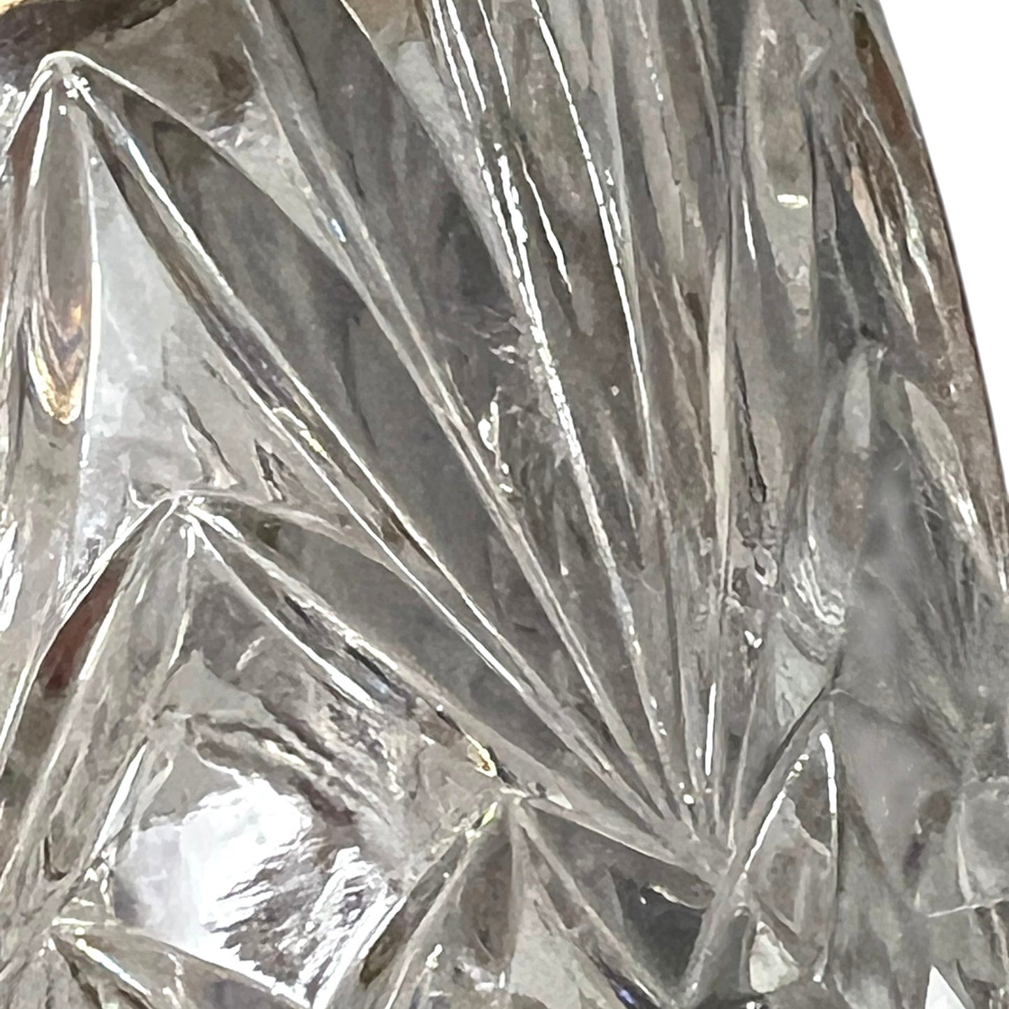 Close up of a French vintage glass ice bucket with silver rim on a white background