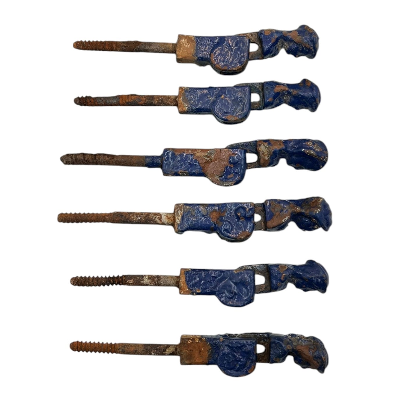 6 French cast iron shutter dogs painted blue with signs and age and wear on a white background