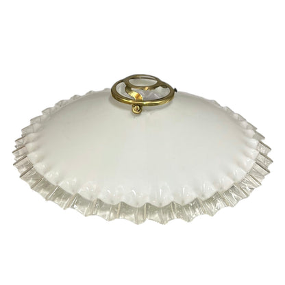 Vintage glass lampshade with ruffled edge and gold fixture on a white background
