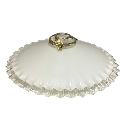 Vintage glass lampshade with ruffled edge and gold fixture on a white background