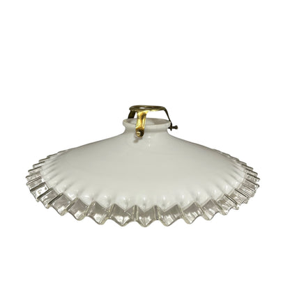 A vintage white ribbed glass lamp shade with a scalloped fluted rim and a brass-colored metal top loop, shown against a plain white background.