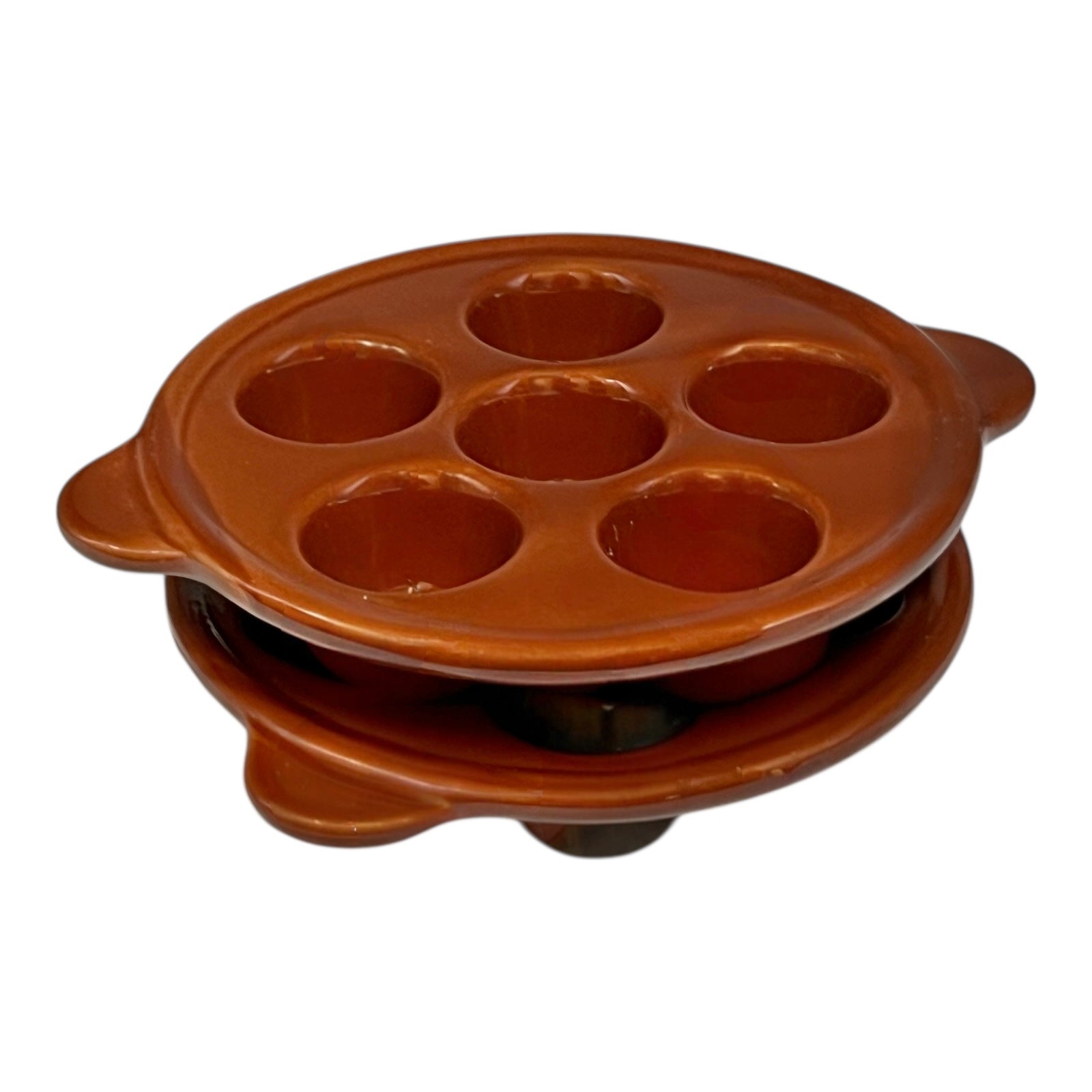 Brown ceramic egg ,snail, or escargots plates with multiple compartments on a white background