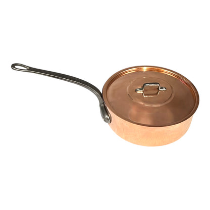 Copper saucepan with lid on a white background