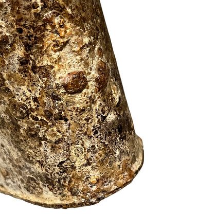 close up of a rusty water bottle on a white background 