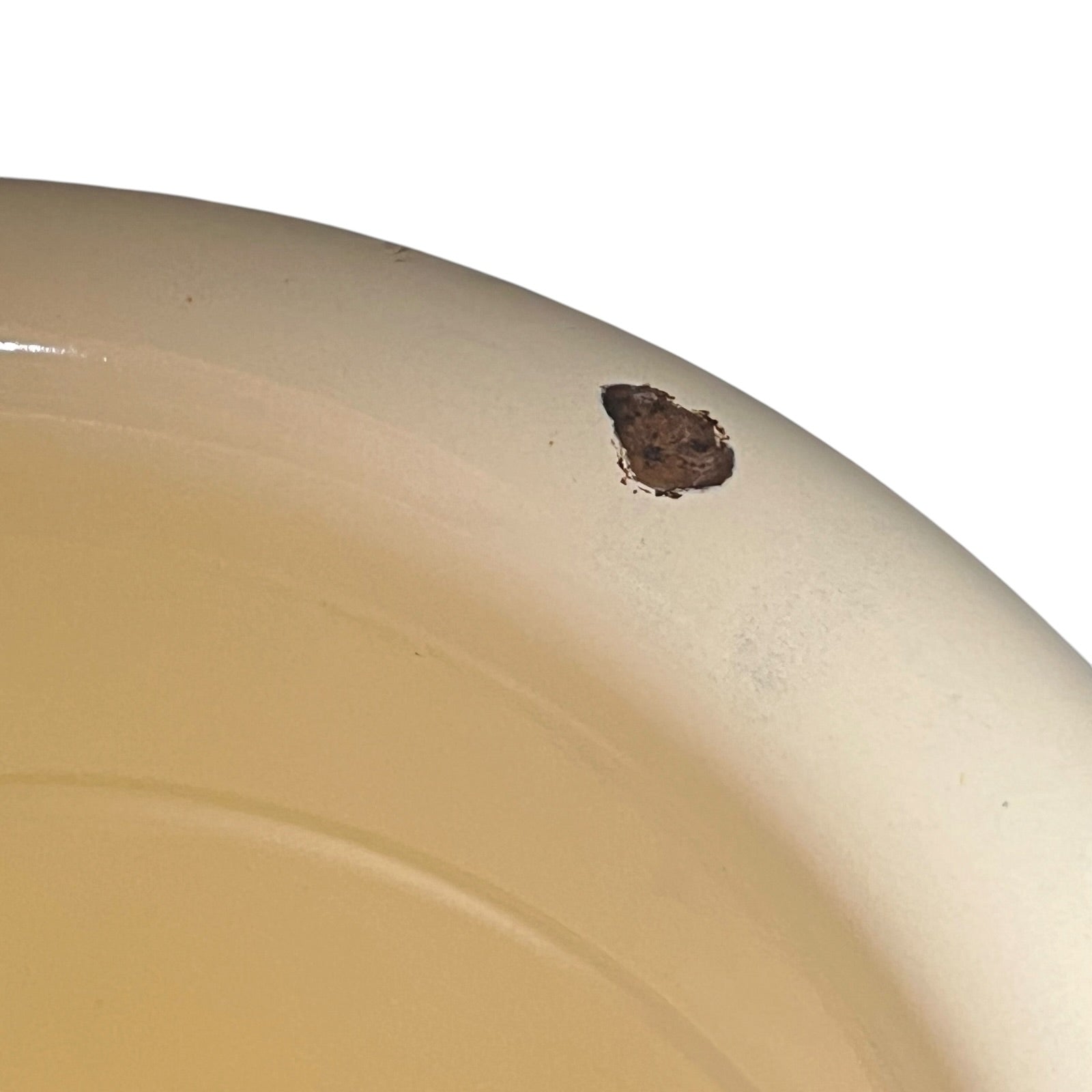 Close up of a French enamel bucket on a white background 