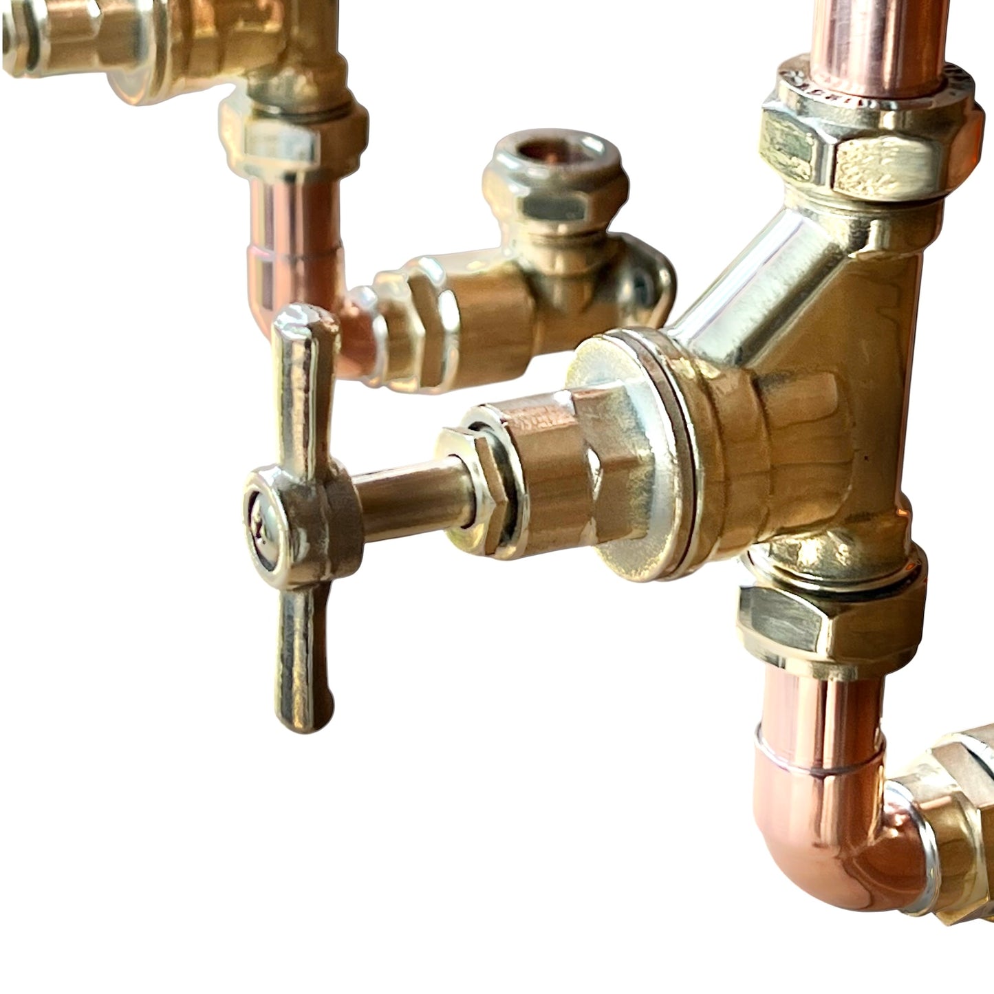 close up of copper and brass tap fitting on a white background 