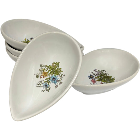 Set of ceramic avocado bowls with floral patterns on a white background