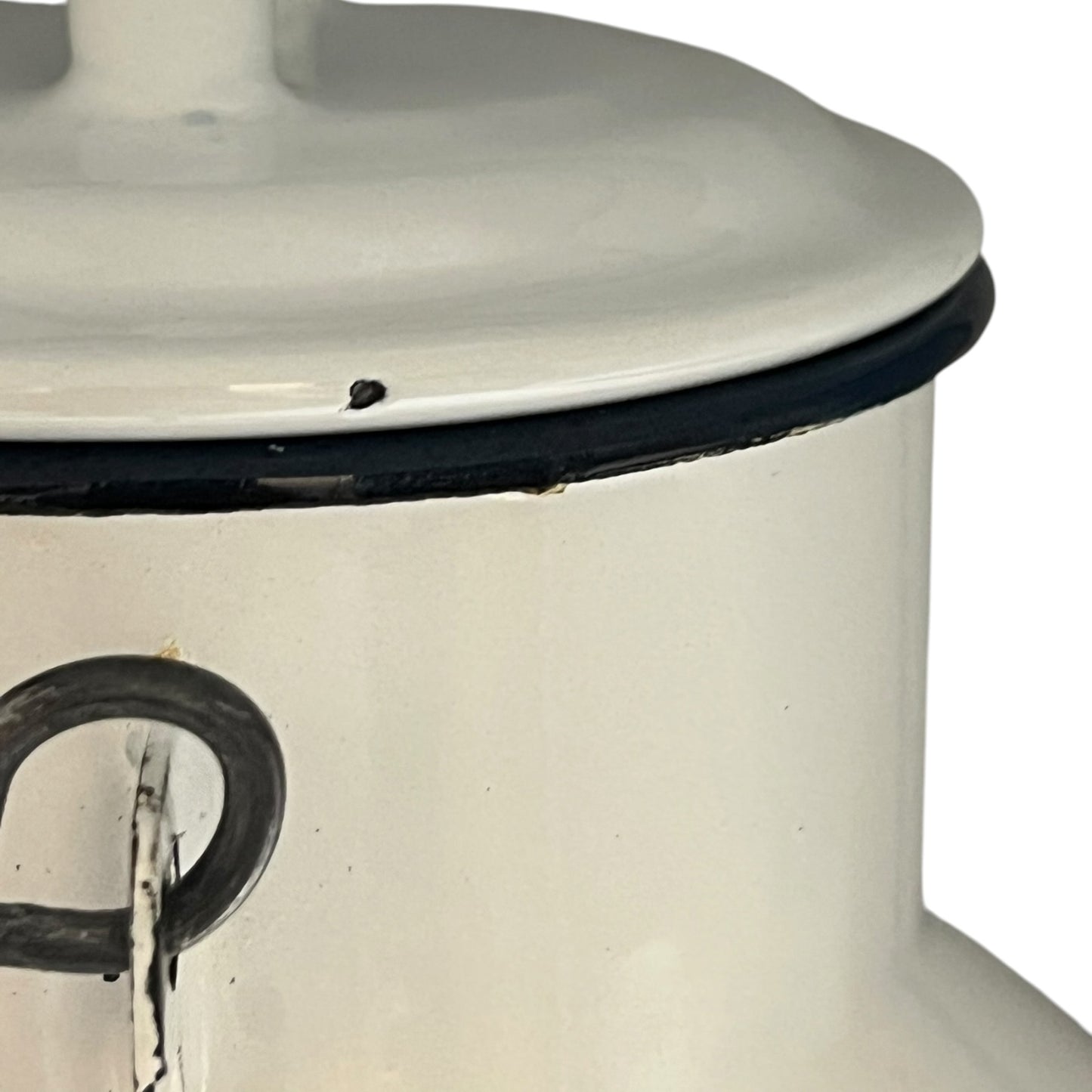 Close up of a white enamel milk churn and mug with duck design on a white background