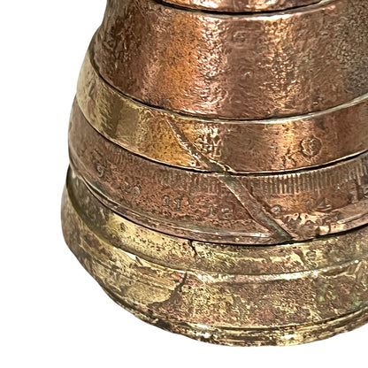 Close up of WW1 brass fuse on a white background