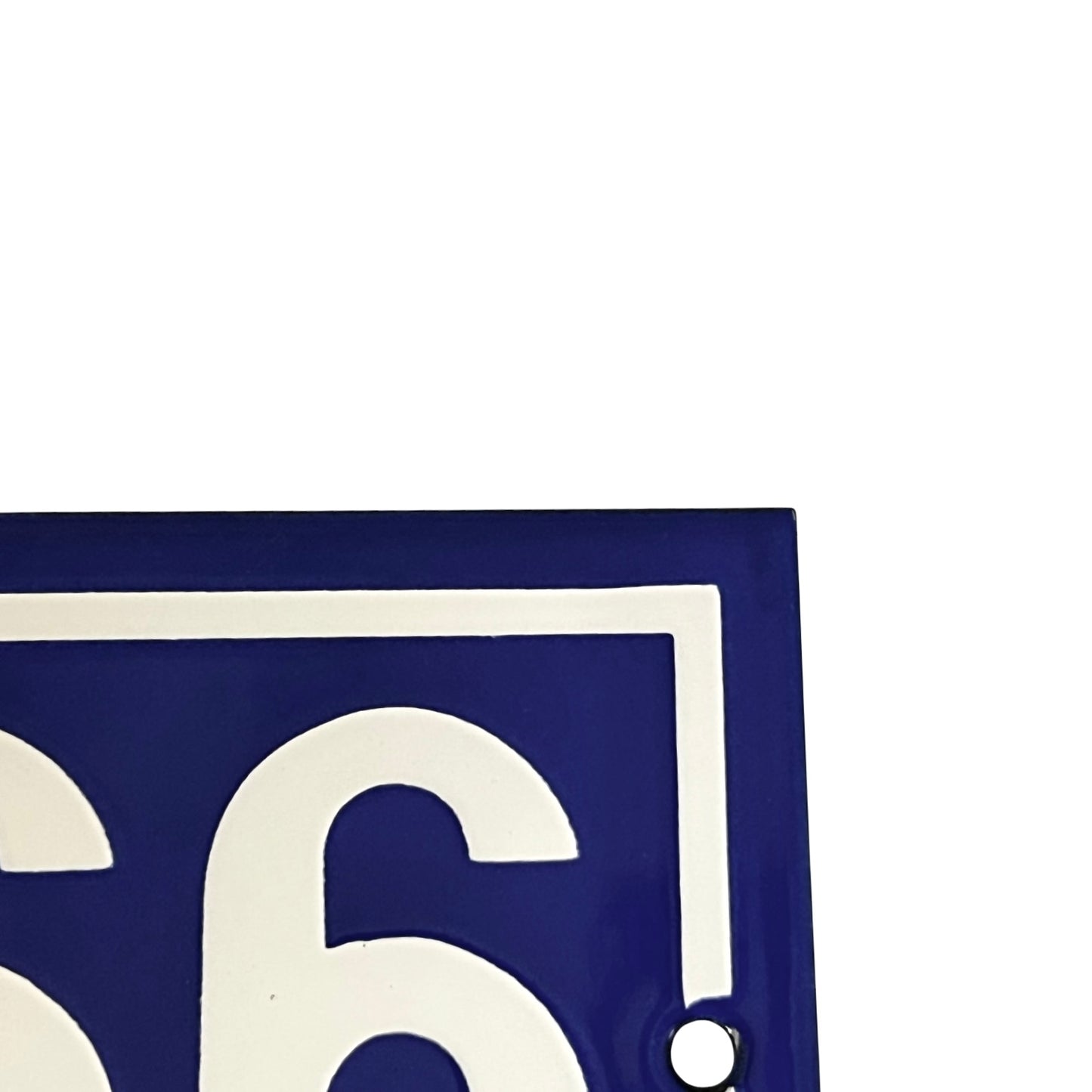 Close up of French blue and white door number 166