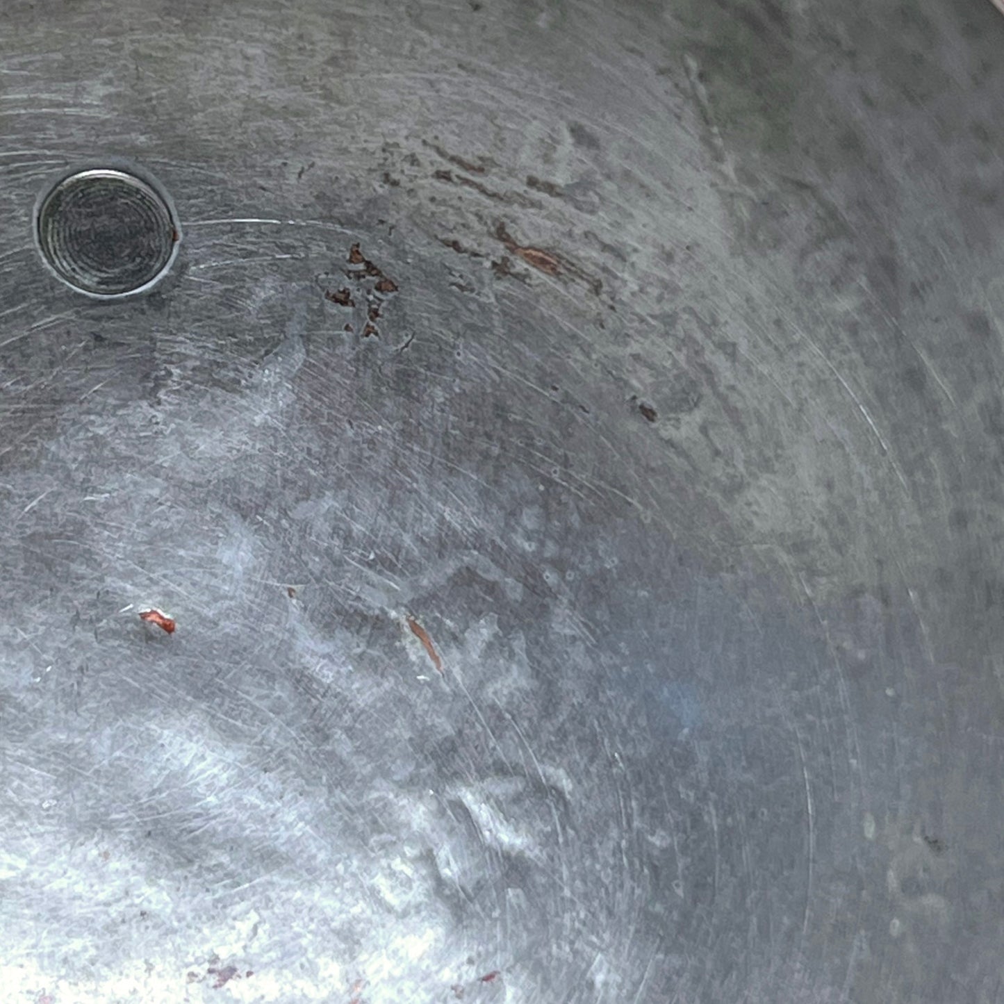 close up inside view of copper ladle