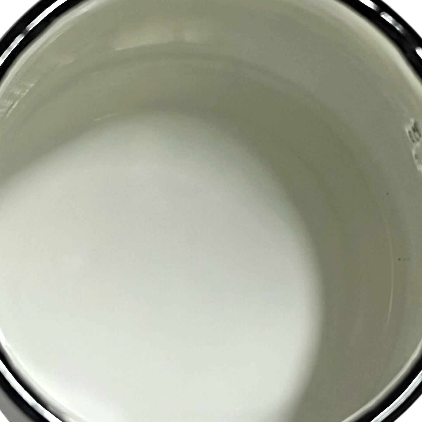 Close up of a French enamel coffee pot on a white background