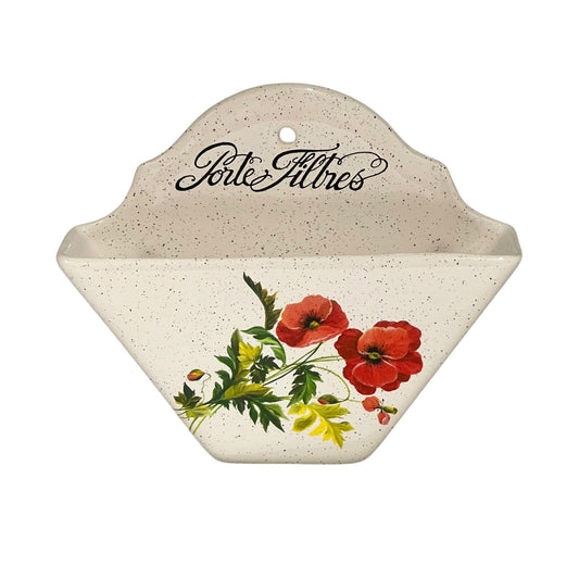A speckled cream-colored ceramic wall-mounted planter with a floral design of red poppies and green leaves on the front, featuring the text 'Portes Filtres' in black script at the top.