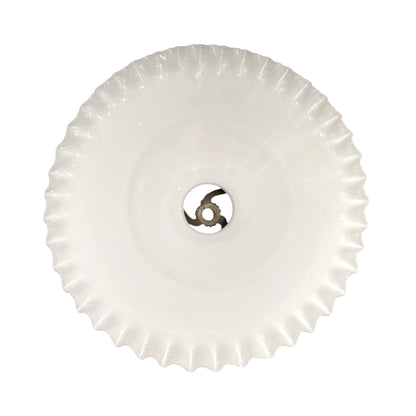 Round white object with a central metallic component on a white background