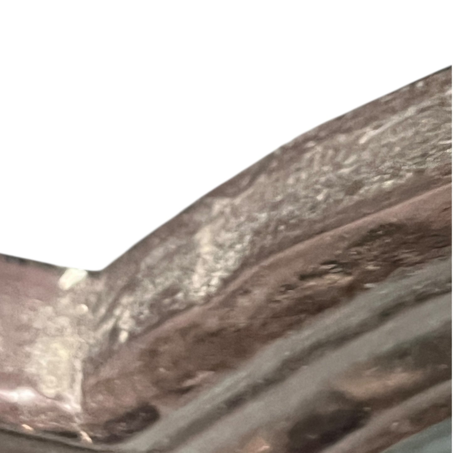 Corner of a framed picture with a dark brown frame and green interior.