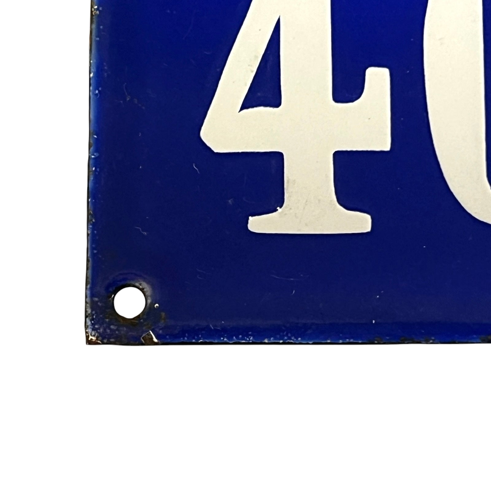 Blue sign with white number '40' on a white background