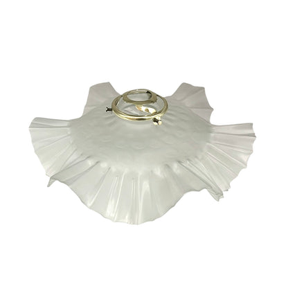 French vintage frosted glass lampshade with a frilled scalloped style edge and a brass collar on a white background
