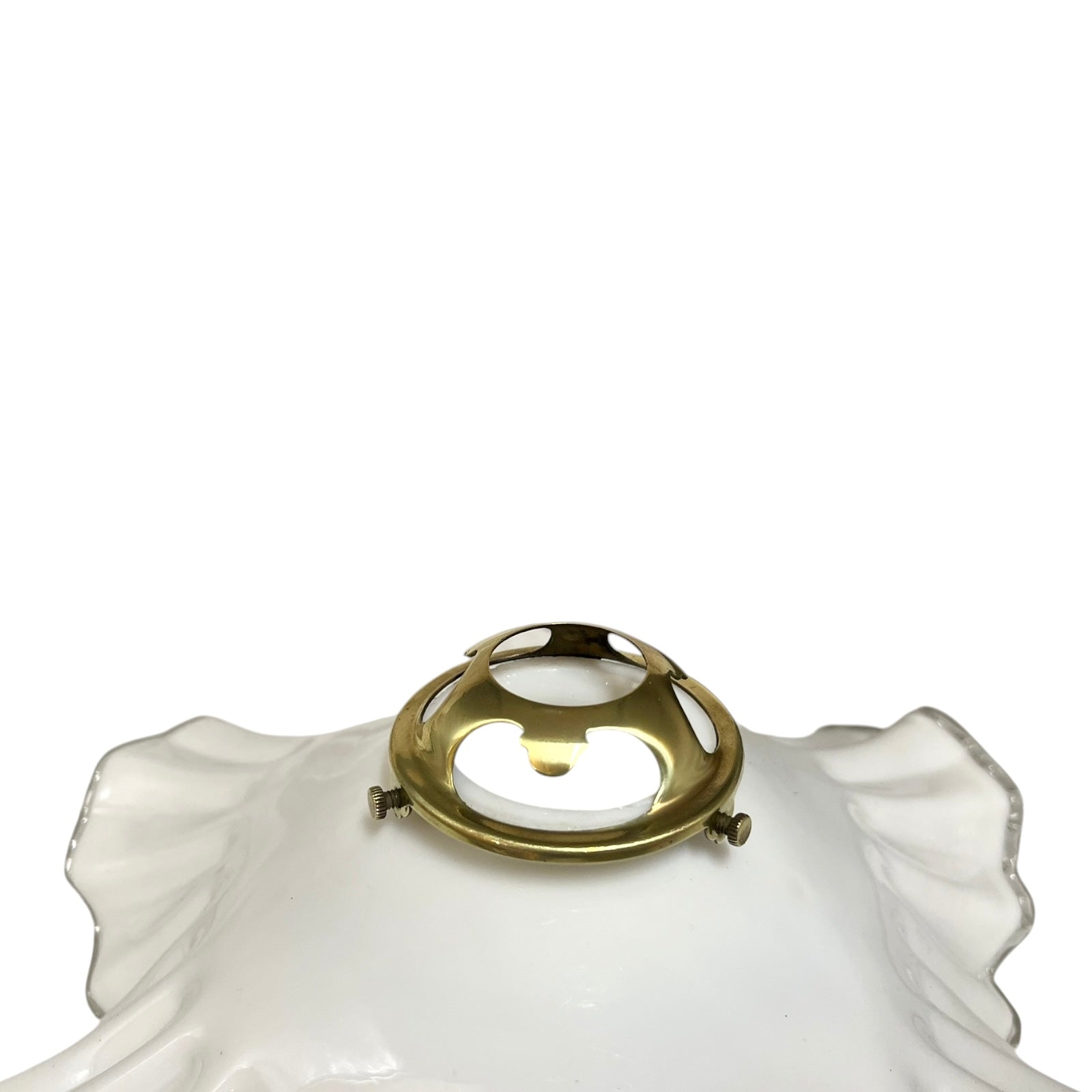 Decorative lamp with white glass shade and brass fitting on a white background